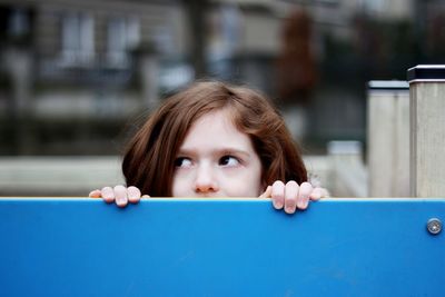 Close-up portrait of young woman looking away