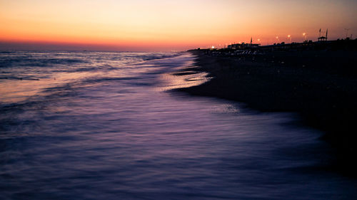 Scenic view of sea against sky at sunset