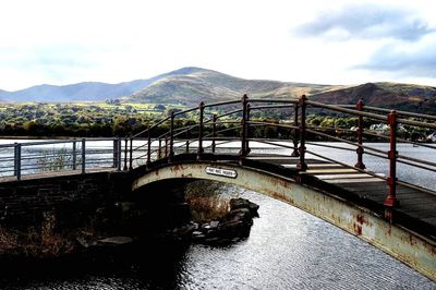 Bridge over river against sky