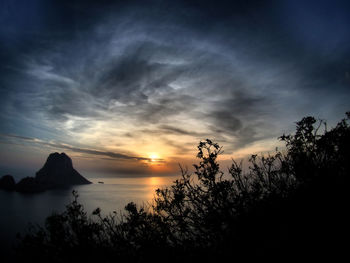 Scenic view of dramatic sky over sea during sunset