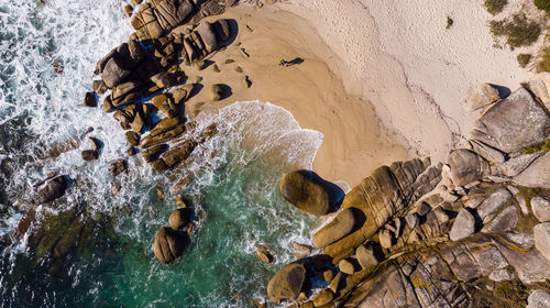 Aerial view of rock formations at beach