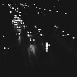 Illuminated tunnel at night