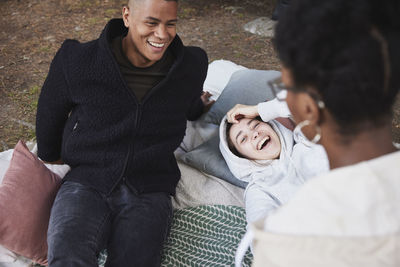 Friends laughing at camping