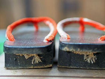 Close-up of geta sandal on hardwood floor at home