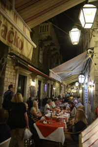 People in restaurant at night