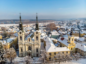 Panoramic view of buildings in city against sky