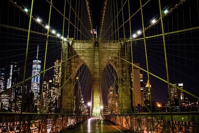 Bridge in city at night