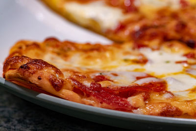 Close-up of pizza in plate on table