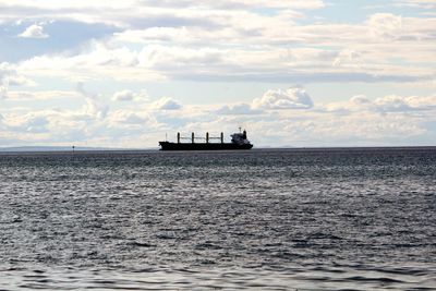 Boat in sea against sky