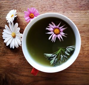 Green matcha tea with edible flowers