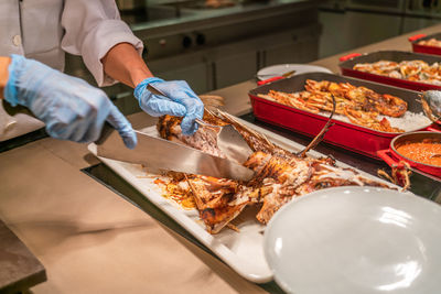 High angle view of person preparing food on table