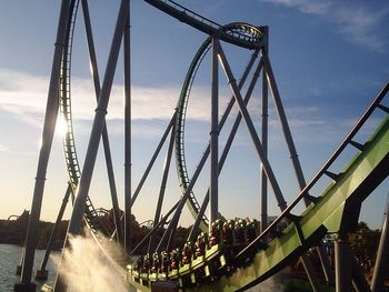 Low angle view of rollercoaster against sky