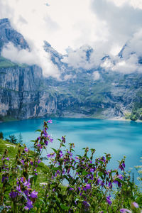 Scenic view of lake against cloudy sky