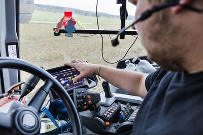 Driver in machine cabin