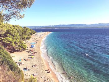Scenic view of beach against clear sky