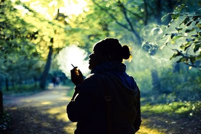 Silhouette of man against tree