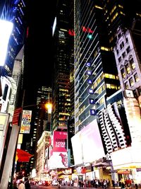 Low angle view of illuminated city at night