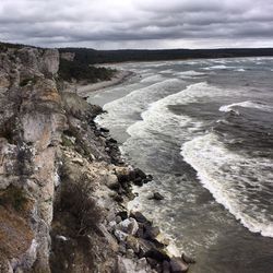 Scenic view of landscape against cloudy sky