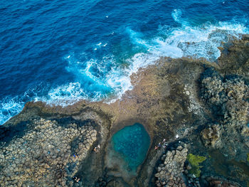 Aerial view of a natural pool in caleta de fuste fuerteventura island drone photography