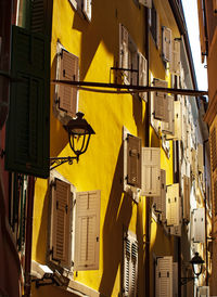 Low angle view of yellow buildings in city