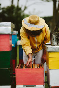 Beekeeper working outdoors