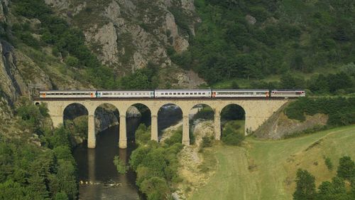 Train on railway bridge over river