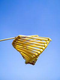 Low angle view of bread against blue sky