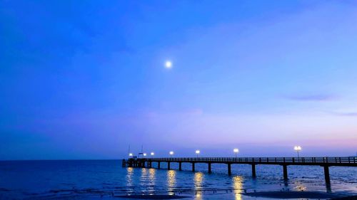 Scenic view of sea against sky at night