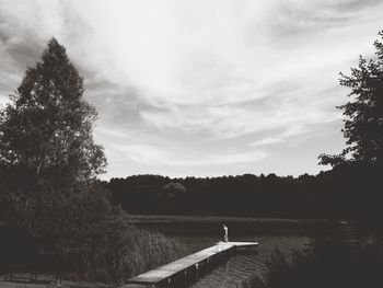 Scenic view of lake against cloudy sky