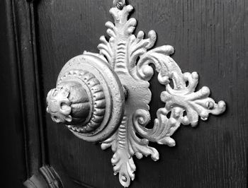 Close-up of dragon sculpture on wooden door