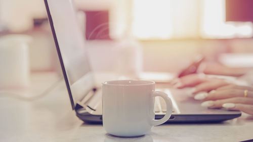 Close-up of coffee cup on table