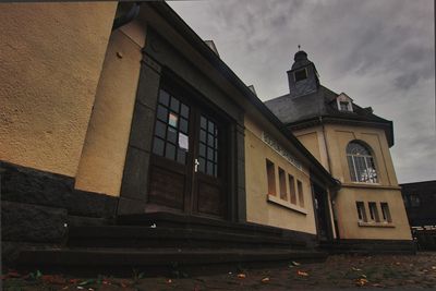 Low angle view of old building against sky