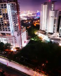 High angle view of illuminated cityscape at night