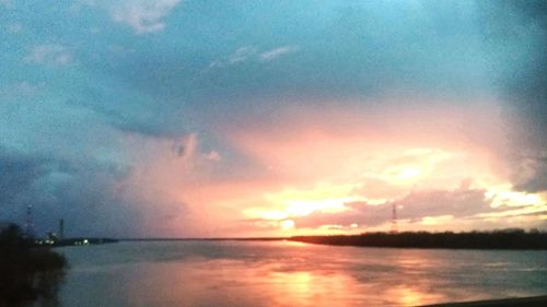 Scenic view of sea against cloudy sky