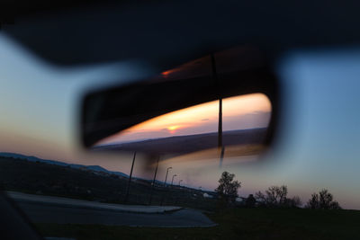 Close-up of illuminated car against sky