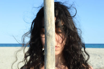Close-up portrait of woman on beach