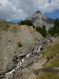 Scenic view of rocky mountains against sky