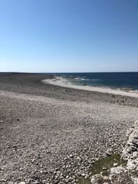 Scenic view of sea against clear blue sky