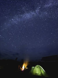 Scenic view of mountains against sky at night