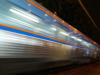 Blurred motion of train at railroad station platform