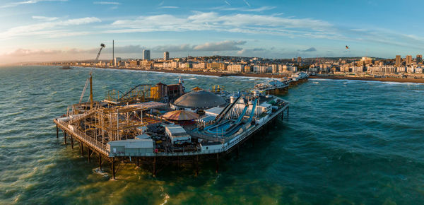 Aerial view of brighton palace pier, with the seafront behind.