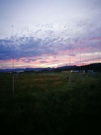 Scenic view of landscape against cloudy sky