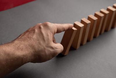 Cropped hand of person holding thermometer