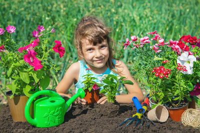 Portrait of cute girl picking flowers