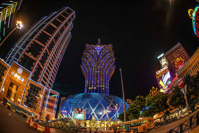 Low angle view of illuminated buildings at night