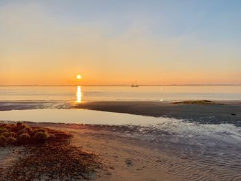 Scenic view of sea against sky during sunset