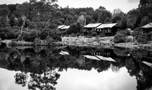 Reflection of trees in lake against sky