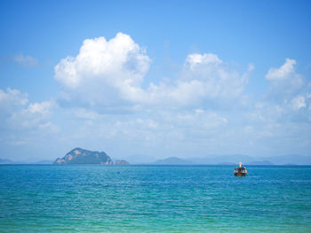 Sailboat in sea against sky