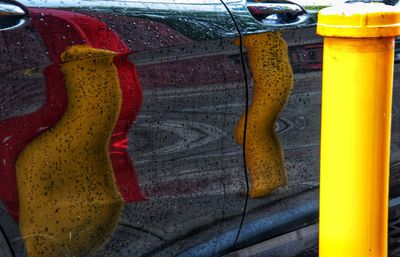 High angle view of multi colored paper hanging on wall