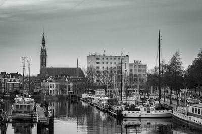 Boats moored at harbor